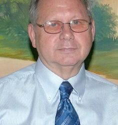 James E. Walker, age 74